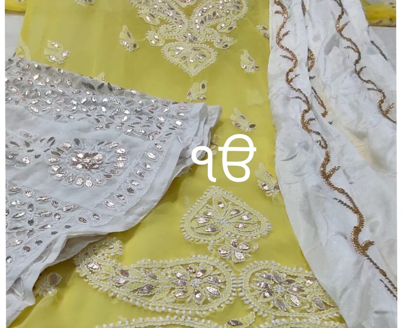 Chikan kurti with sharara and duppatta.